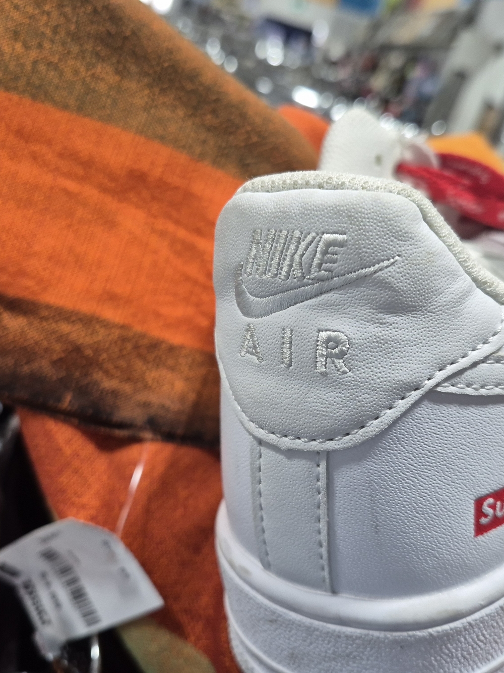 Nike White Supreme Leather Air Sneaker with Red Logo Accent
